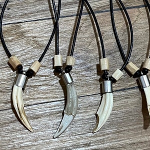 Monkey Fang (Resin Replicas) and Camel Bone Beads on 22” Leather Cord