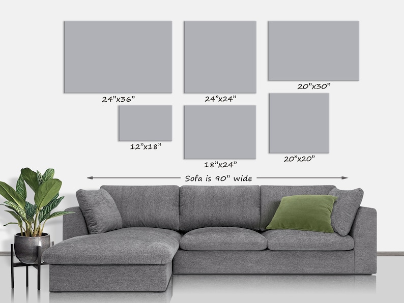 May include: A display of six gray rectangular wall art pieces of varying sizes, including 24"x36", 24"x24", 20"x30", 12"x18", 20"x20", and 18"x24". A gray sectional sofa with a green pillow is below the art. The sofa is 90" wide.