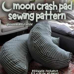 May include: Two crescent-shaped floor cushions featuring a dark green and white striped fabric pattern. The text on the image reads: moon crash pad sewing pattern, @hannahadeleshome, and beginner friendly 8.5 x 11 or a0 print.