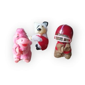 Vintage pencil grippers plush animals Spuds MacKenzie dog University Georgia Bulldogs and pink alligator 1980s collectible huggers grabbers