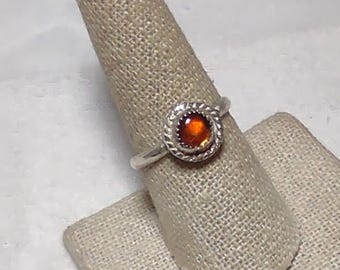 natural amber cabochon is set in handmade sterling silver ring size 9