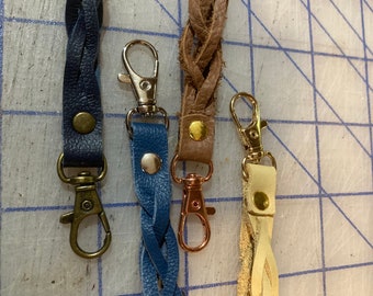 Leather zipper pull. Sturdy clasp, great for jackets, purses, or suitcases. Silver or gold clasps now available.