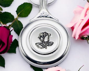 Flute Key Necklace with hand engraved rose made from real flute key hanging from a matching silver snake chain.