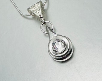 Silver Piccolo Key Necklace with Swarovski Crystal hanging from a silver embossed bail with silver plated snake chain. Limited edition.