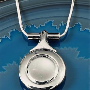 Flute Key Necklace (Plateau) with Extra mechanism on both sides of neck includes Silver snake chain.