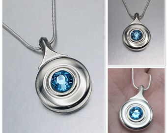 Flute Key Necklace silver (open hole) with Blue Topaz Swarovski Crystal hanging on complimentary silver plated snake chain.