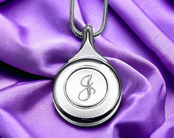 Engraved Silver Flute Key Necklace with Elegant Script Lettering and matching silver snake chain.