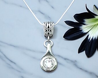 Flute Key Necklace made out of a silver flute trill key, with a Clear Swarovski Crystal on Decorative Bail with Comp. snake chain necklace.