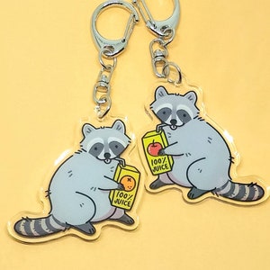 Raccoon Keychain — Trash Animal Keychain — Cute Animal Keychain — Raccoon Drinking Orange Juice Apple Juice — Double Sided Acrylic Charm