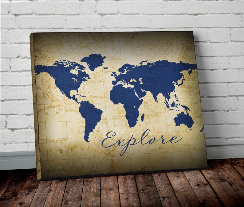 explore world map wall art canvas world map print in navy etsy