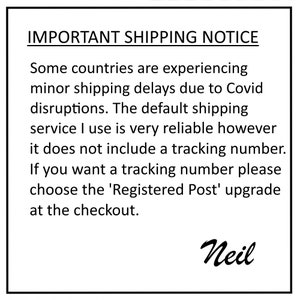 May include: A white rectangular sign with black text that reads "IMPORTANT SHIPPING NOTICE". The text explains potential shipping delays and the option to upgrade for tracking. The signature "Neil" is at the bottom.