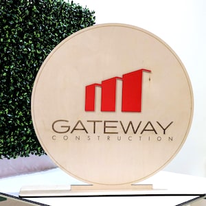 May include: A set of three ceramic nesting bowls in graduating sizes. The bowls feature a speckled, matte finish in shades of cream, light brown, and dark brown. The largest bowl measures approximately 8 inches in diameter.