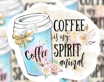 May include: A white sticker with a blue and pink coffee cup with gold glitter and a bow. The text on the sticker reads "Coffee is my spirit animal".
