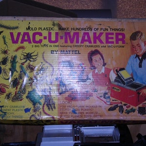 May include: A vintage box for a Mattel Vac-U-Maker toy set. The box features a colorful illustration of creepy crawlers and a boy using the Vac-U-Maker to create plastic models. The text on the box reads "Mold Plastic... Make Hundreds of Fun Things! Vac-U-Maker 2 Big Toys in One featuring Creepy Crawlers and Vac-U-Form by Mattel."