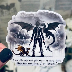 May include: A sticker featuring a woman with long black hair and a black outfit standing between two dragons. The woman is holding two swords. The background is a stormy sky with lightning. The text on the sticker reads "I am the sky and the power of every storm that has ever been. I am infinite."