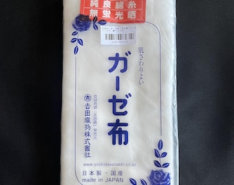 May include: A package of white gauze cloth, made in Japan. The package has Japanese text and a red label with text. The dimensions are 30 cm x 10 m, and it is 100% cotton.