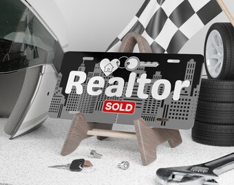 Realtor Vanity License Plate with Cityscape Background and a Sold Sign