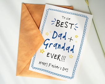 May include: A white card with a blue border and blue and yellow text that reads "To the BEST Dad + Grandad EVER!!! Happy Father's Day". The card is sitting on a brown envelope.