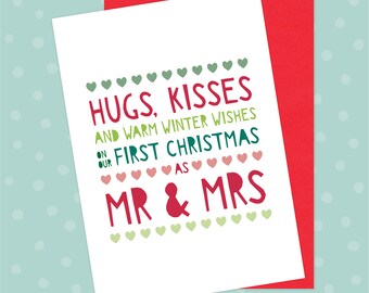 May include: A white card with green and red hearts and the text "Hugs, Kisses and warm winter wishes on our first Christmas as Mr & Mrs".