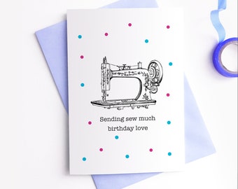 May include: A white card with a black and white illustration of a sewing machine. The card has pink and blue dots scattered around the image. The text on the card reads "Sending sew much birthday love."