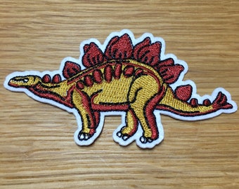 Rot-oranger Stegosaurus- Dinosaurier Patch 10cm x 5cm zum Aufbügeln -  Dino Aufnäher