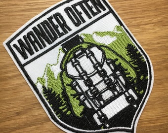 Coat of arms patch "Wander often" 9.5 cm x 7.5 cm for travel, backpacker & camping to iron out