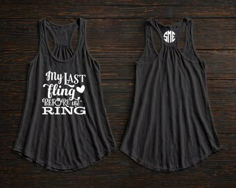 May include: Two black racerback tank tops. One tank top has the text "My LAST fling before the RING" in white script. The other tank top has the initials "SME" in a white circle.