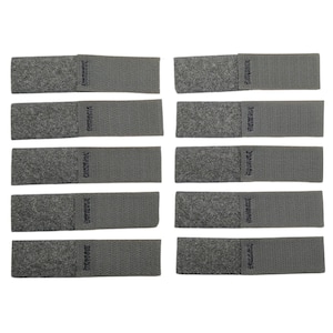 May include: Ten gray hook and loop fastener strips. The strips are arranged in two rows of five. Each strip is approximately 2 inches long and 1/2 inch wide.