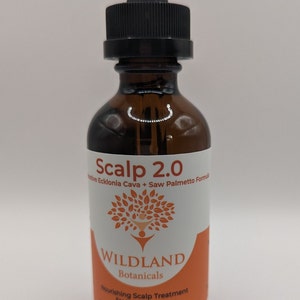 May include: A brown glass bottle with a dropper top and a white label. The label says "Scalp 2.0", "WILDLAND Botanicals", "Nourishing Scalp Treatment", "For Men & Women", and "2 fl oz. Hand-crafted with love in USA".