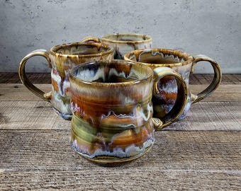 14 oz wheel thrown ceramic coffee mug Orange green and blue drip glazes Hand crafted Makes a great gift