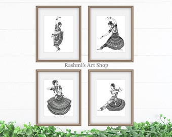 May include: Four black and white framed prints of a woman in a traditional Indian dance pose. The prints are arranged in a grid pattern on a white wall. The text "Rashmi's Art Shop" is printed below the prints.