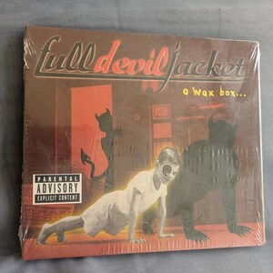 May include: Sealed CD of "Full Devil Jacket" album. The cover art features a child with a spiral eye, doing a push-up, with a dark silhouette of a devil-like figure. The album title is in red and black text, with a parental advisory warning.