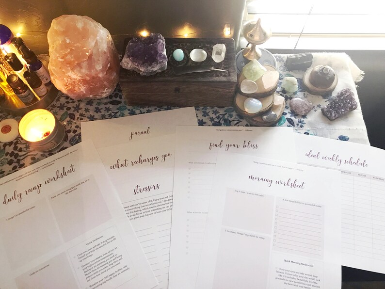 May include: A set of printable worksheets designed for self-care and wellbeing. The worksheets feature titles such as "Daily Recap Worksheet", "What Recharges You", "Stressors", "Find Your Bliss", "Morning Worksheet", and "Ideal Weekly Schedule".