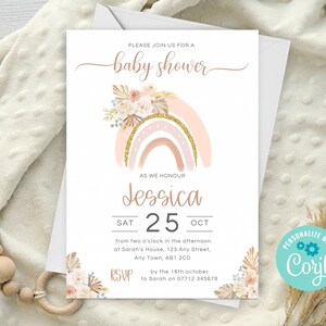 May include: A baby shower invitation with a pink and gold rainbow with floral accents. The text reads "Please join us for a baby shower as we honour Jessica Sat 25 Oct from two o'clock in the afternoon at Sarah's House, 123 Any Street, Any Town, AB1 2CD RSVP by the 16th october to Sarah on 07712 345678"