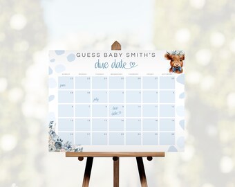 May include: A blue and white calendar with the text "Guess Baby Smith's due date" and a cute cartoon highland cow with a blue bow tie. The calendar is set up for June and July with the due date marked on July 7th.