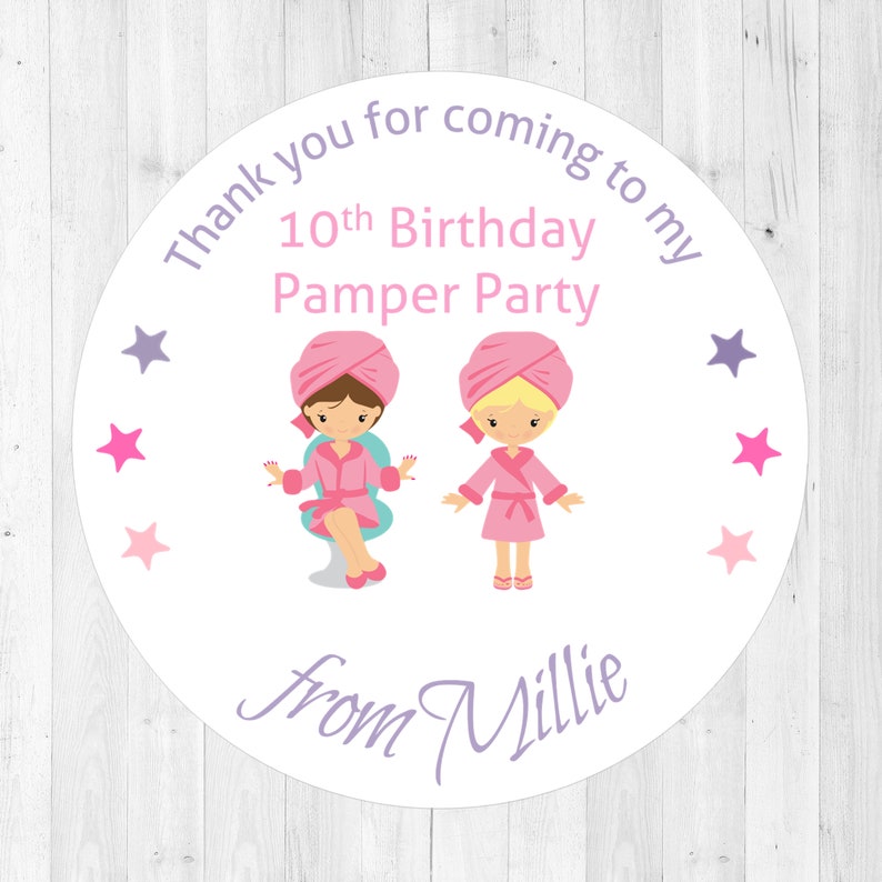May include: Round white sticker with purple text that says "Thank you for coming to my 10th Birthday Pamper Party from Millie". There are two cartoon girls wearing pink robes and white towels on their heads. The girls are surrounded by pink and purple stars.