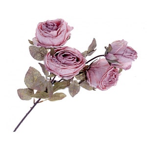 May include: A single stem of artificial roses in a dusty rose hue. The roses have detailed petals and are in various stages of bloom. The leaves are a muted gold colour. The stem is dark brown. The flowers are set against a white background.