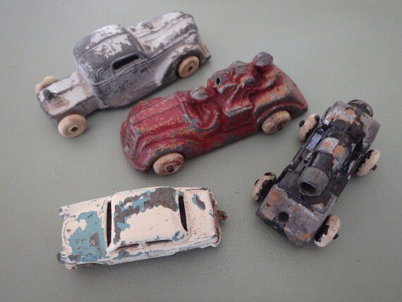 Antique Diecast Car (austin A50 Made in England by Lesney No. 36), Truck  (RALSTOY Made in USA), Cannon, Firetruck (made USA) Rubber Tires