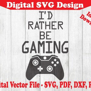 Peut inclure: Un design numérique avec une manette de jeu vidéo et le texte "I'd Rather Be Gaming".
