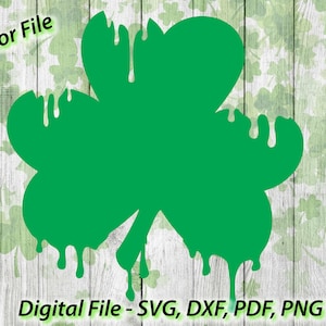 May include: A green shamrock with a dripping effect, ideal for crafting projects or digital designs. The shamrock is isolated on a white background with a woodgrain texture.