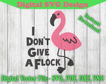 May include: A pink flamingo with black eyes and a black beak stands on a white wooden background. The text "I Don't Give A Flock" is written in black letters below the flamingo.