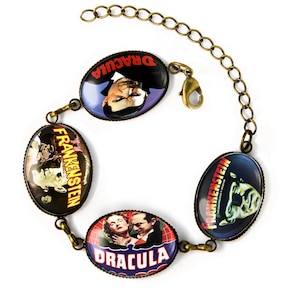 May include: A bronze chain bracelet with four oval-shaped charms featuring vintage movie posters. The charms feature the titles "Dracula" and "Frankenstein" with images of the classic horror movie characters.