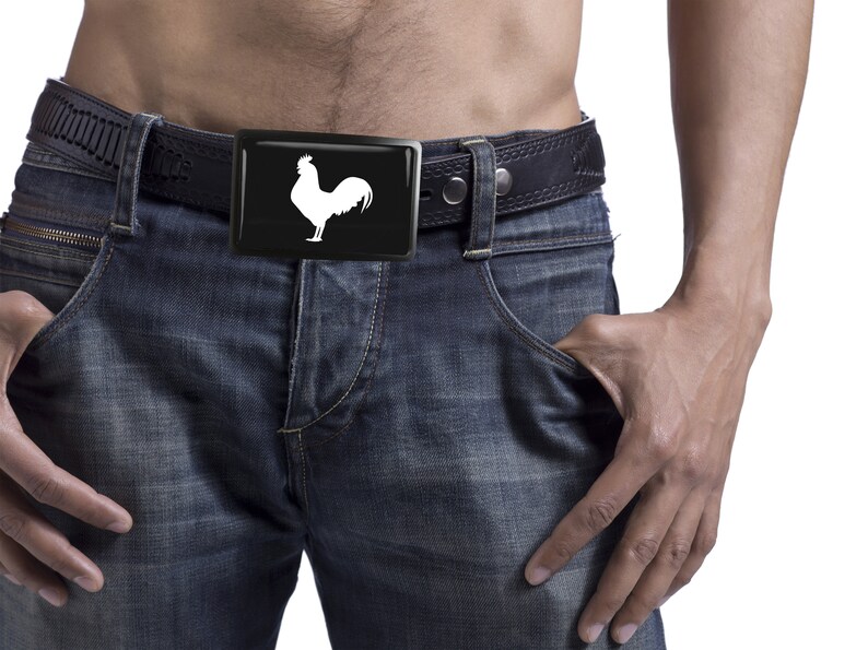 May include: A black leather belt with a silver buckle featuring a white rooster silhouette.