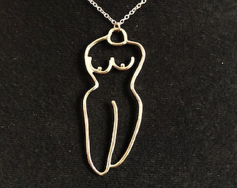 Necklace with a nude female pendant