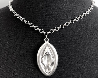 Necklace with a vagina pendant