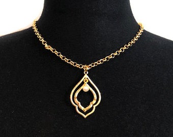 Necklace with a vagina pendant