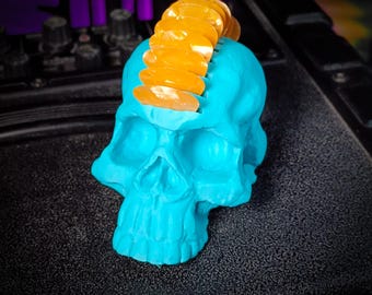 Soporte para púas de guitarra con forma de calavera (turquesa)