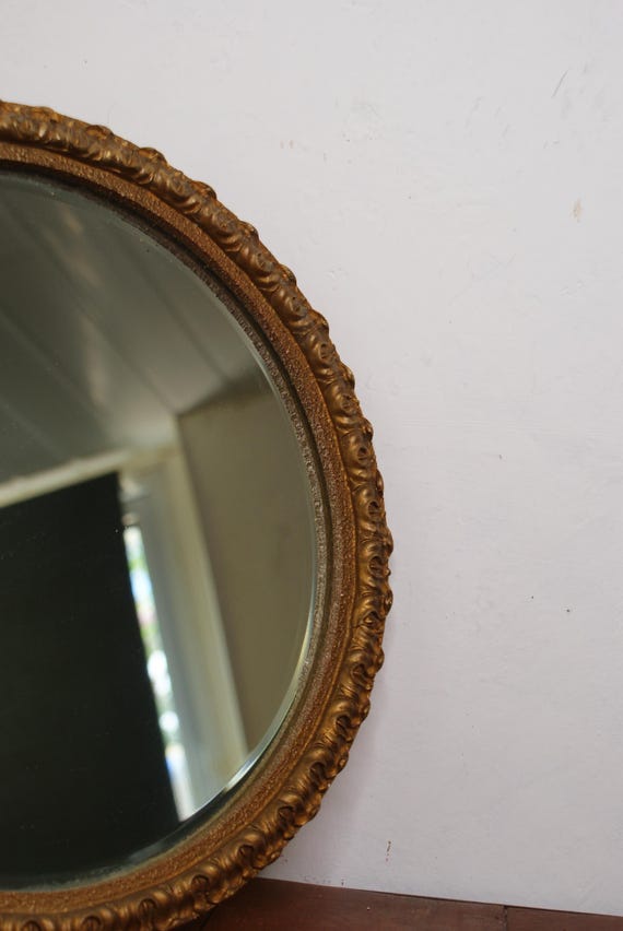 Antique Round Bevelled Mirror In a Guilt Wood and Plaster Frame