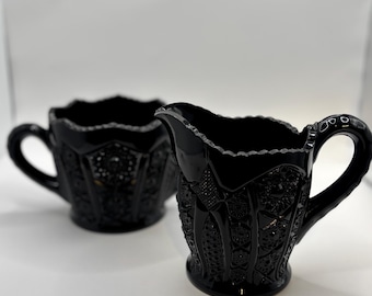 Juego de cremera y azucarero de cristal Vintage Tiara Indiana, con panel negro y diseño Daisy Monarch.