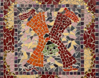 Glass mosaic wall panel of a jolly green=faced clown